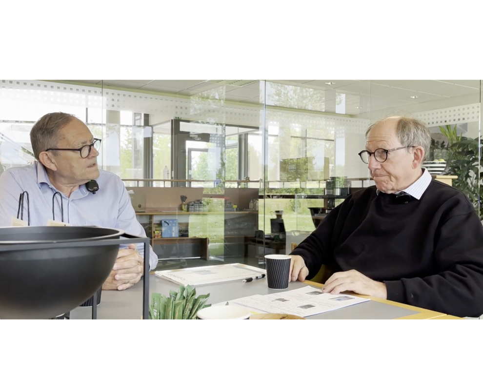 Foamico specialist and customer in a meeting, reflecting on past endeavors and achievements.