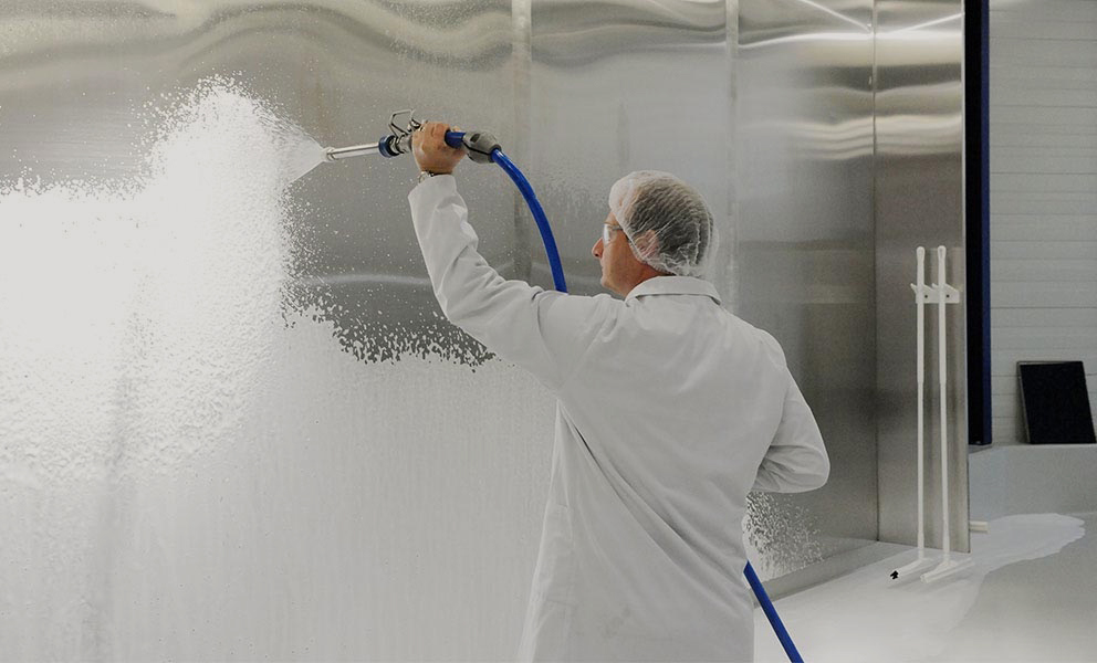 Low pressure foam cleaning in a food production facility